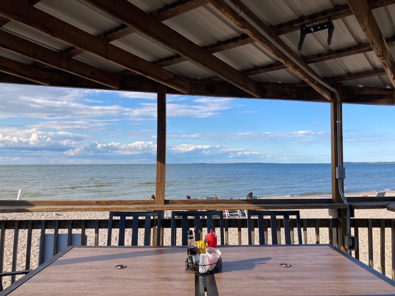 Outdoor table with view of Lake Erie in background.