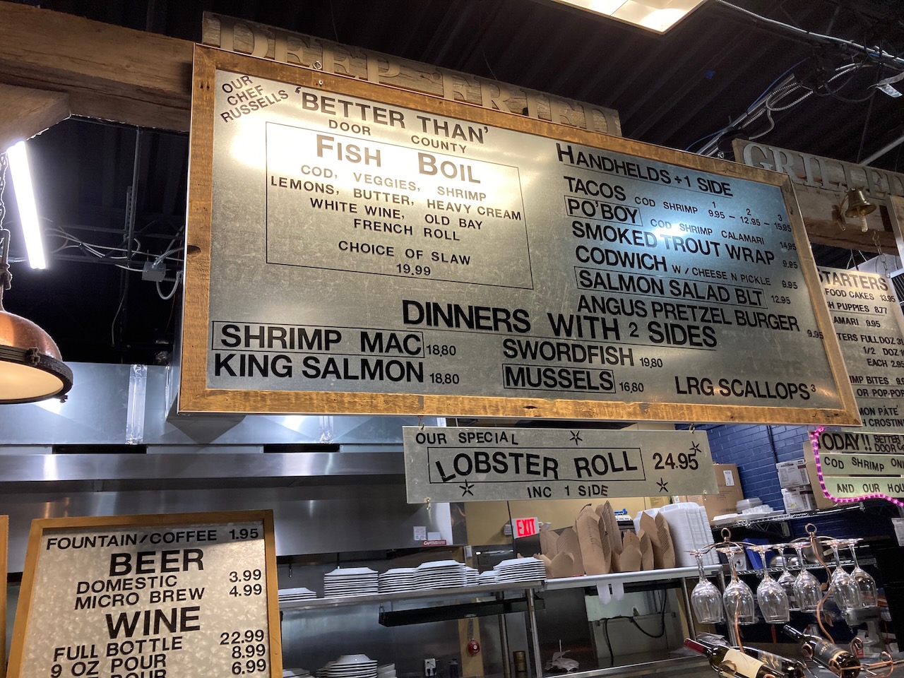 Sandwich board with menu at Lake Edge Seafood.