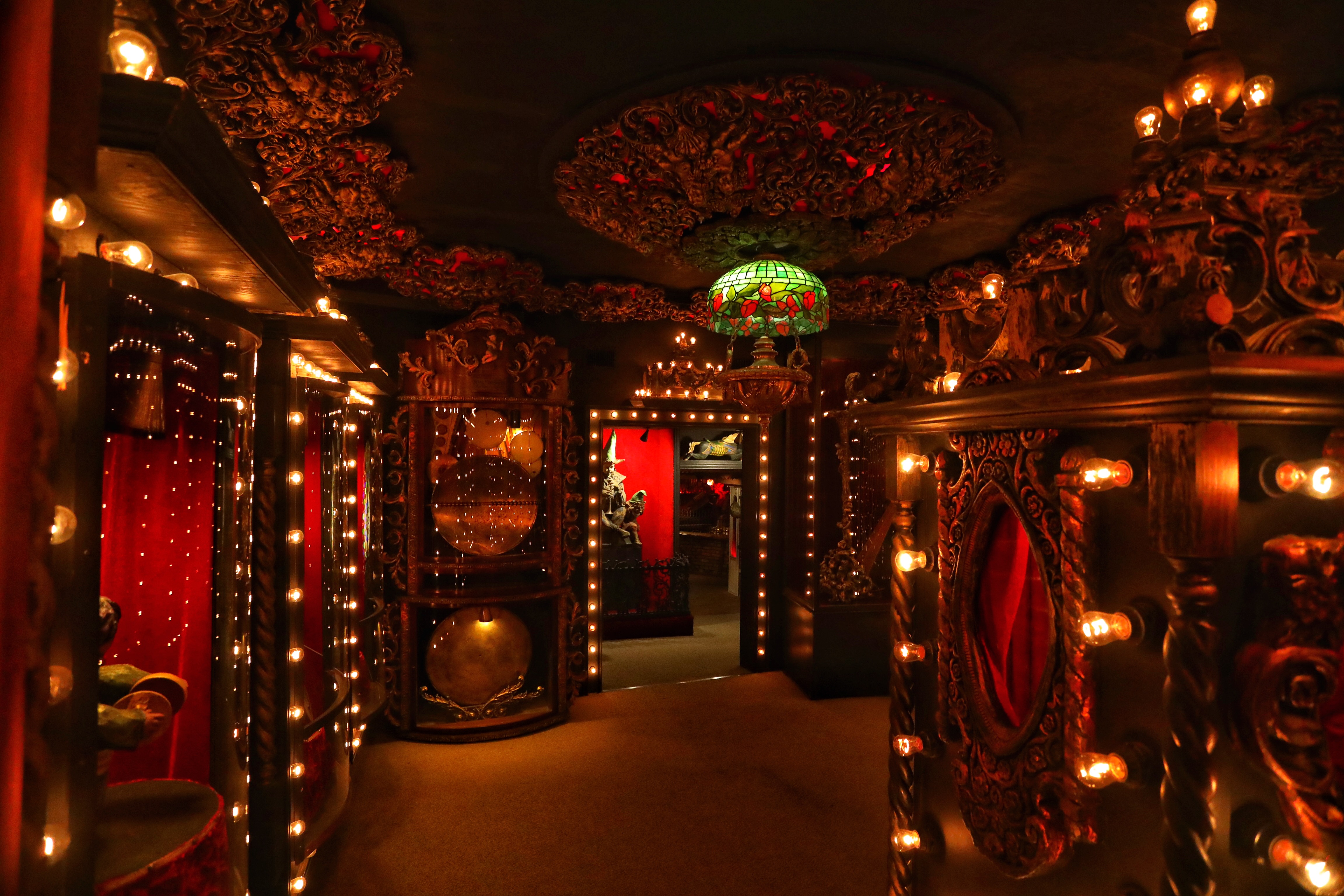 Red room lit with lightbulbs.