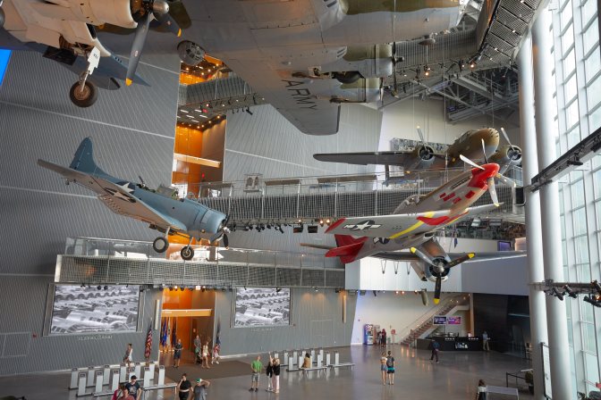 Collection of American warplanes hanging from ceiling.