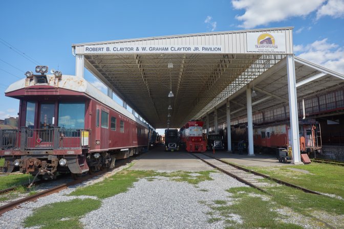 Exterior of train yard, with view of pavilion that covers trains.