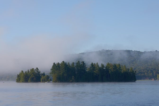 Mist covering Fourth Lake and surrounding mountains.