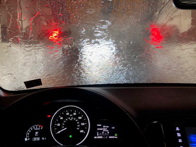 View of inside of car wash through front windshield of Honda HR-V.