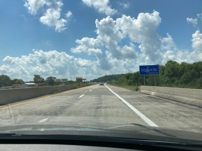 Missouri State Line marker on highway.