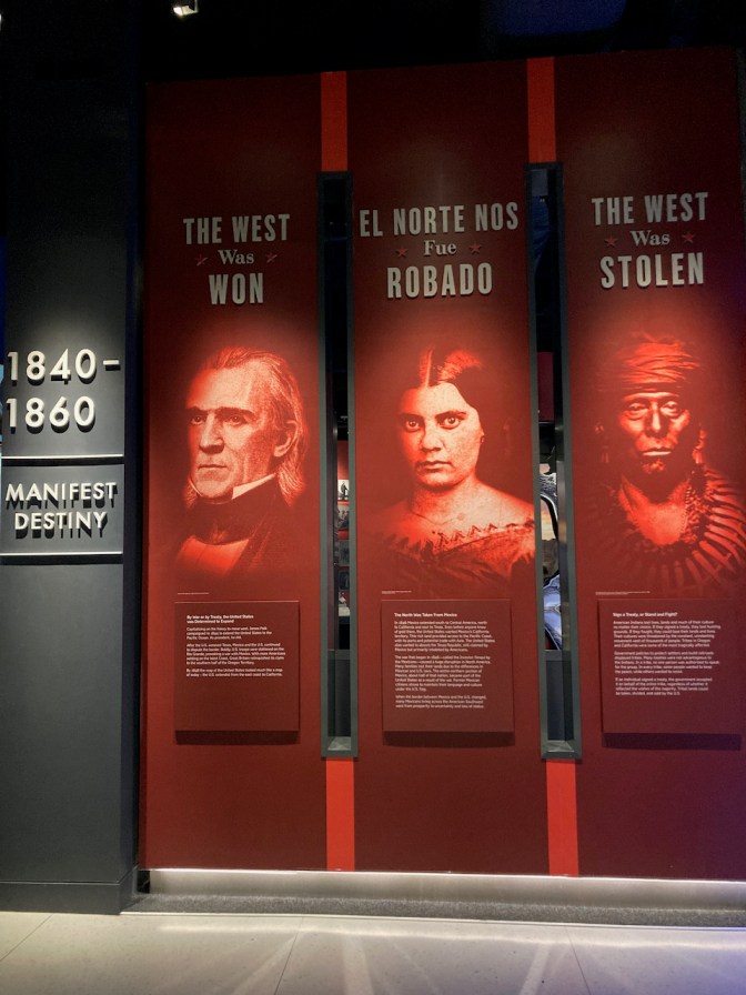 Display on Manifest Destiny, with perspectives of white, hispanic, and native american peoples.