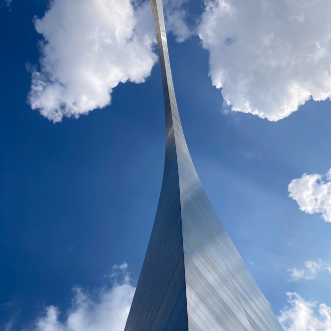 Photograph of arch from between base legs, looking up.