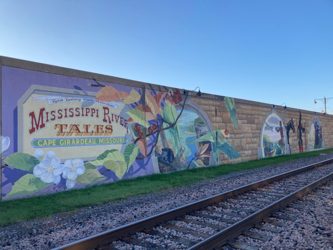 Mississippi River Tales murals on flood wall.