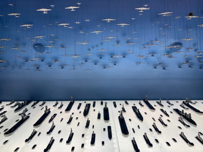 Diorama of planes and ships involved in invasion of Normandy.