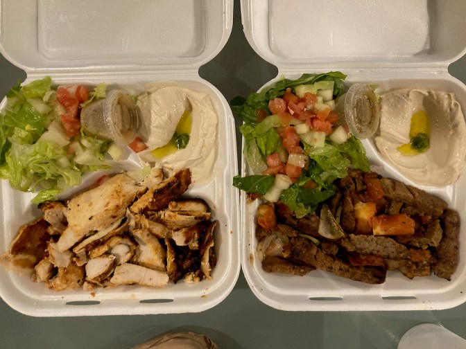 Takeout containers of chicken schwarma and gyro.