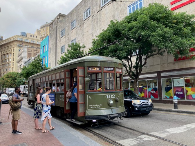 St. Charles Streetcar with passengers boarding.