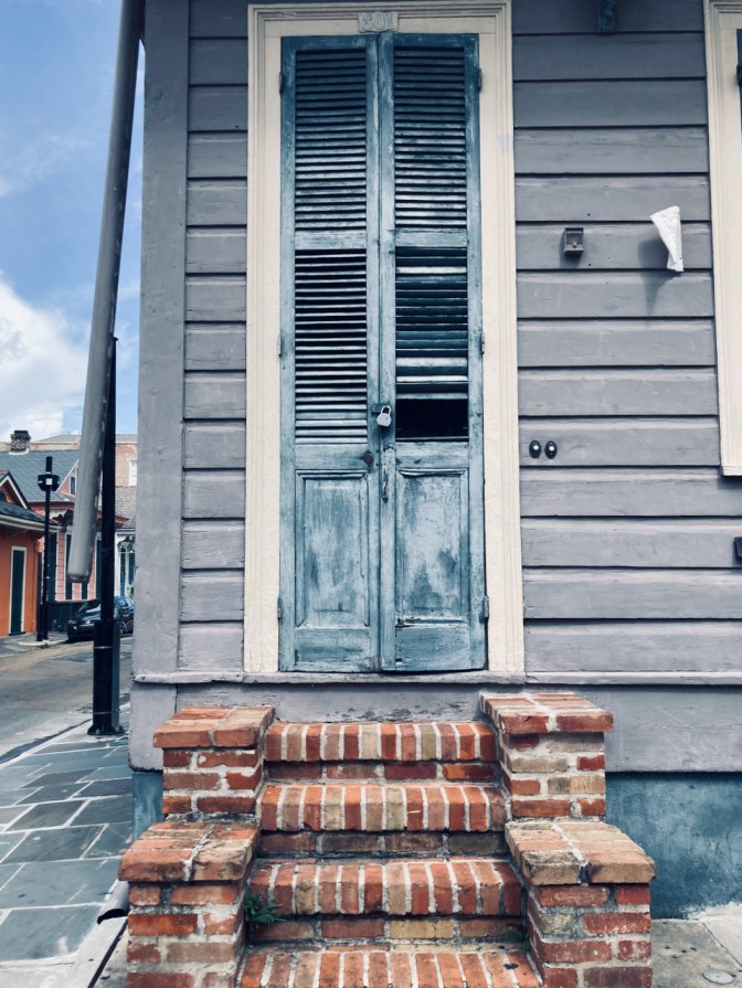 Wooden door in building in French Quarter.