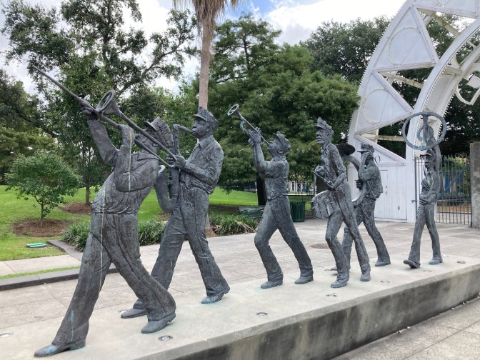 Statues of jazz musicians on parade.