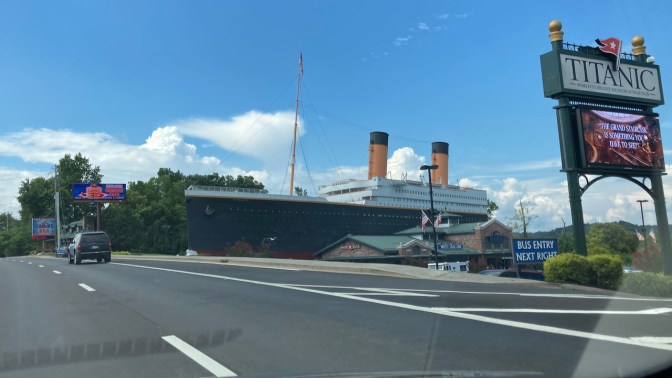 Titanic Museum with replica of half of the RMS Titanic beside road.