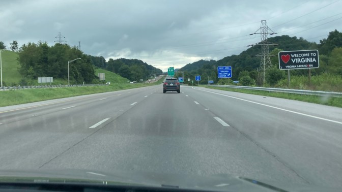 Highway with roadside sign that reads WELCOME TO VIRGINIA.
