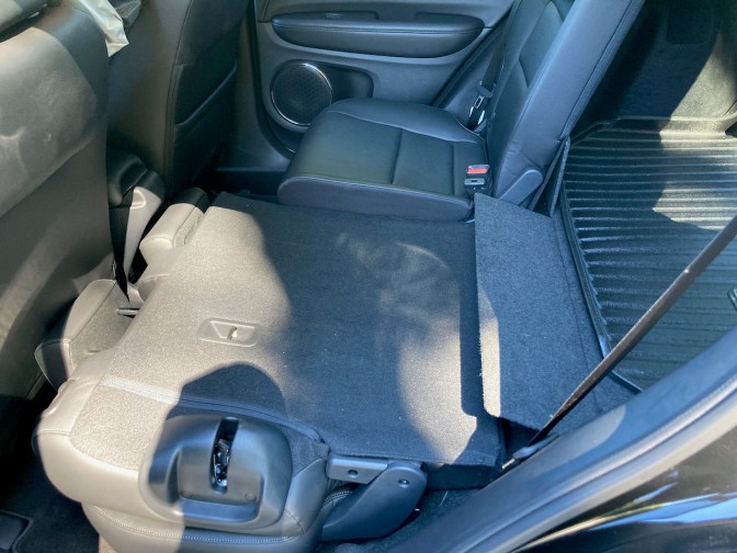 Rear seat of Honda HR-V with one half down and one-half up.