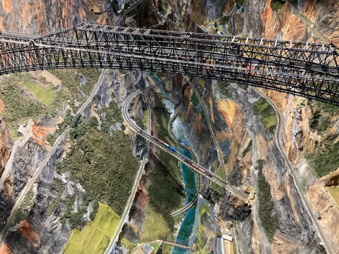 Model railroad bridge over model canyon.
