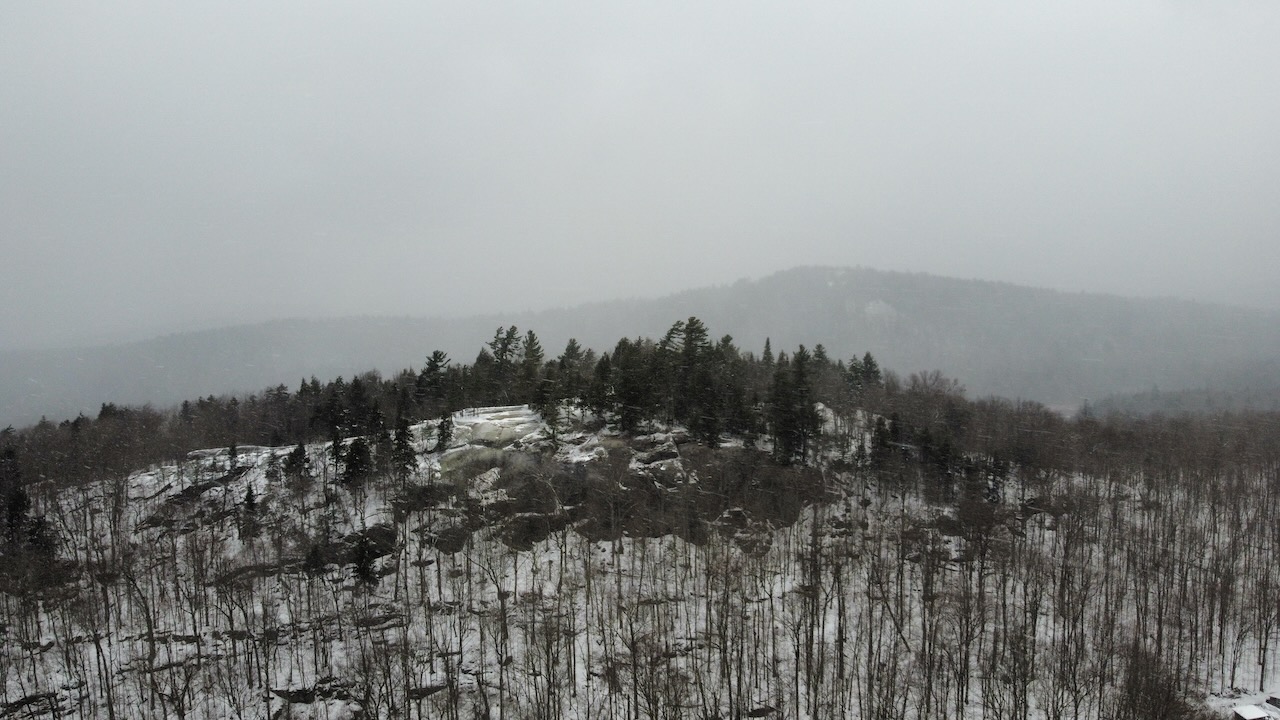 View of Eagle Cliff and surrounding mountains.