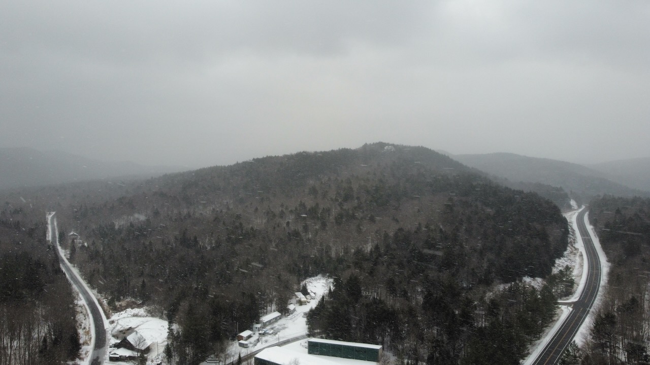 View of mountains of Adirondacks, along with NY-28 and Uncas Road.