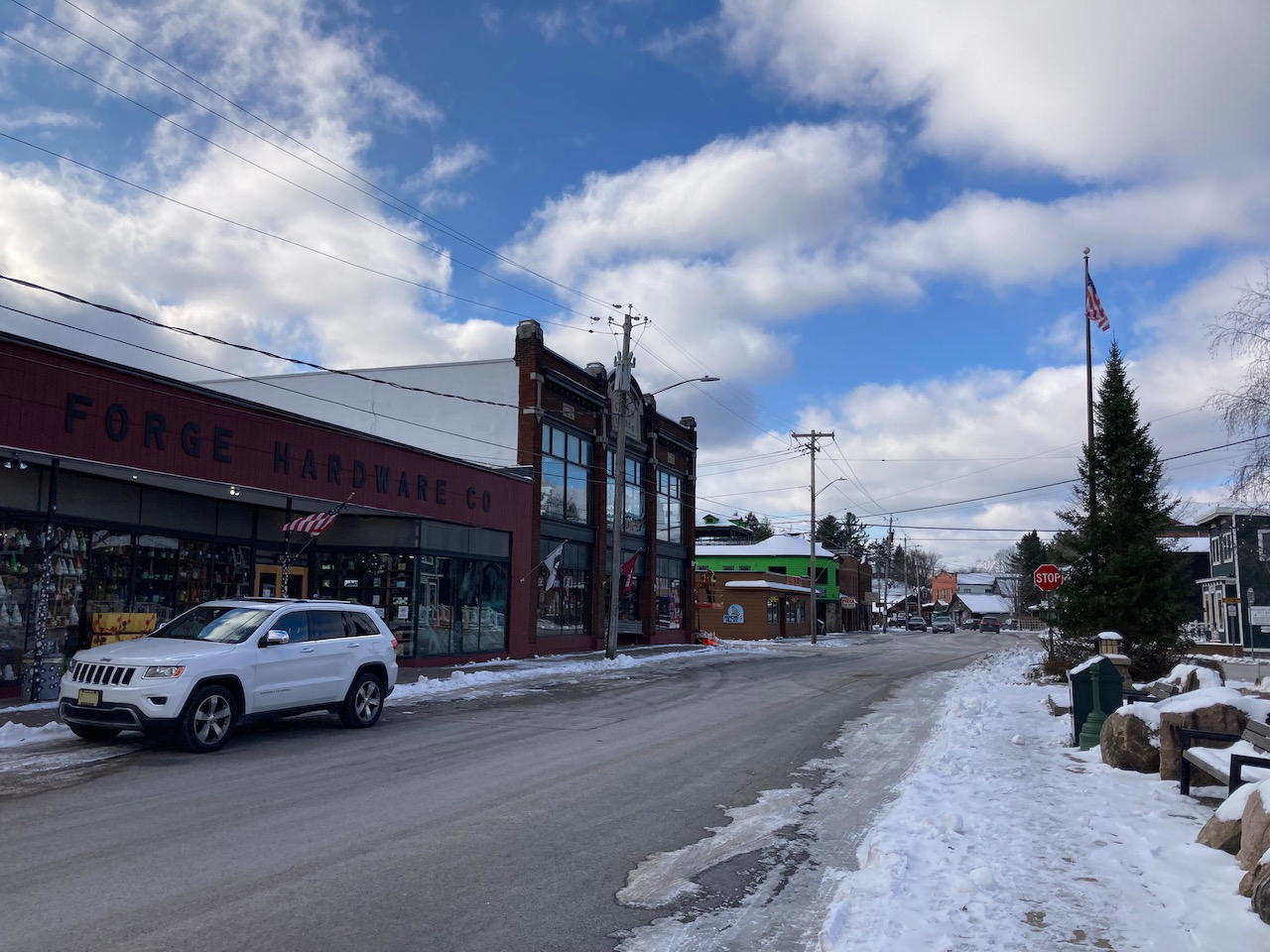 2014 Jeep Grand Cherokee parked in front of Old Forge Hardware.