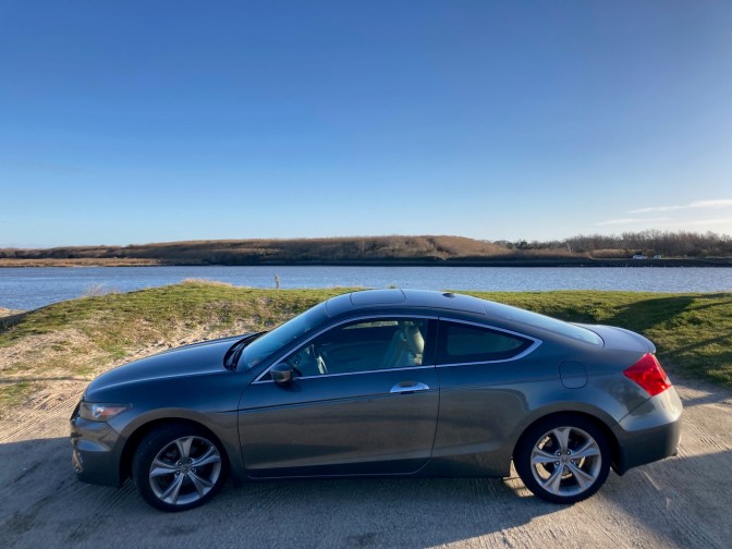 2012 Honda Accord coupe parked in front of Cape May ferry channel.