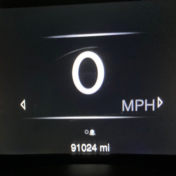 Car odometer reading 91024 miles.