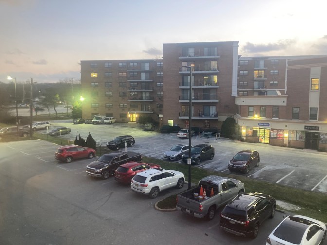 Parking lot at hotel, with 2014 Jeep Grand Cherokee in lot.