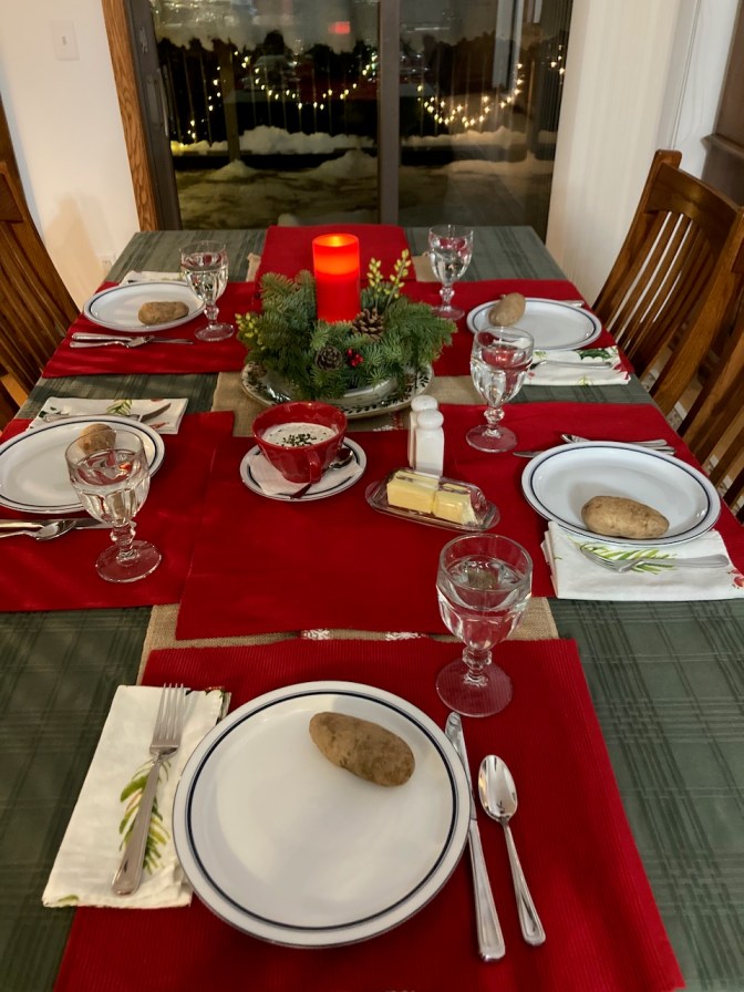 Dinner table set for Christmas dinner.