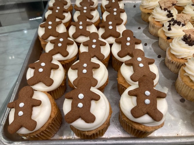 Cupcakes with gingerbread men on top.