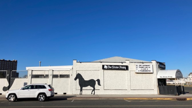 2014 Jeep Grand Cherokee, parked in front of The Stone Pony.