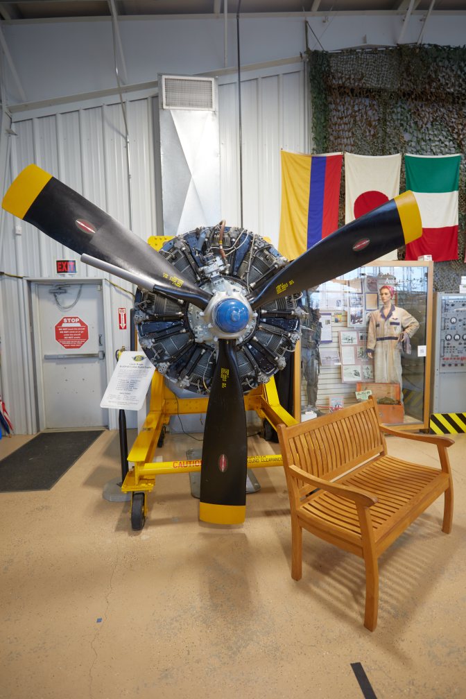 Curtis-Wright 9-cylinder radial engine on stand in museum.