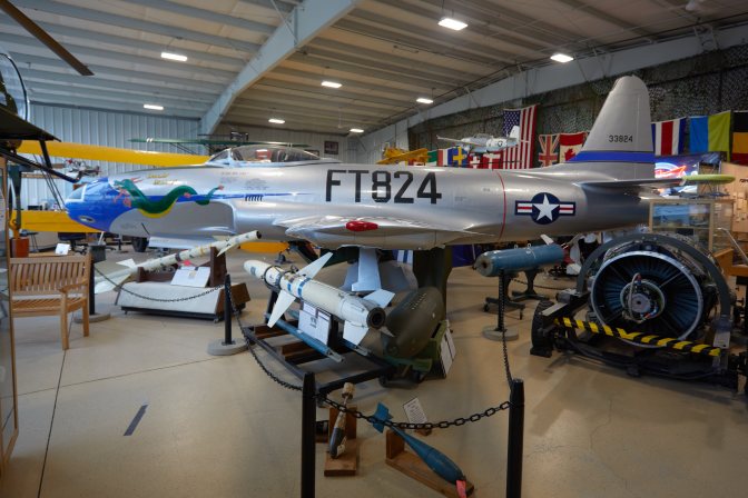 Interior of museum, with Lockheed P80C Shooting Star in background.