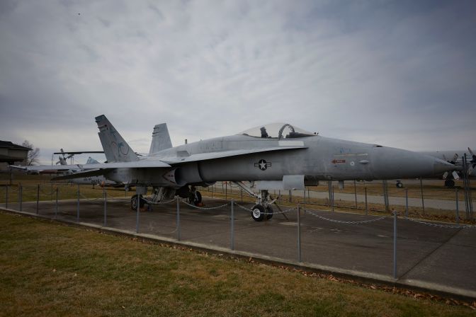 F/A-18A Hornet fighter jet, parked on concrete pad.