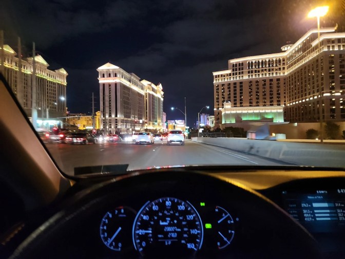 View of Las Vegas from behind dashboard of Honda Accord.