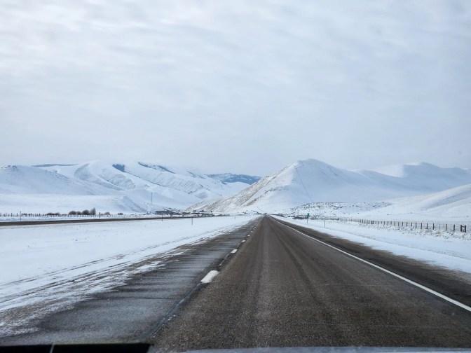 View of mountains in distance, with interstate highway in foreground.