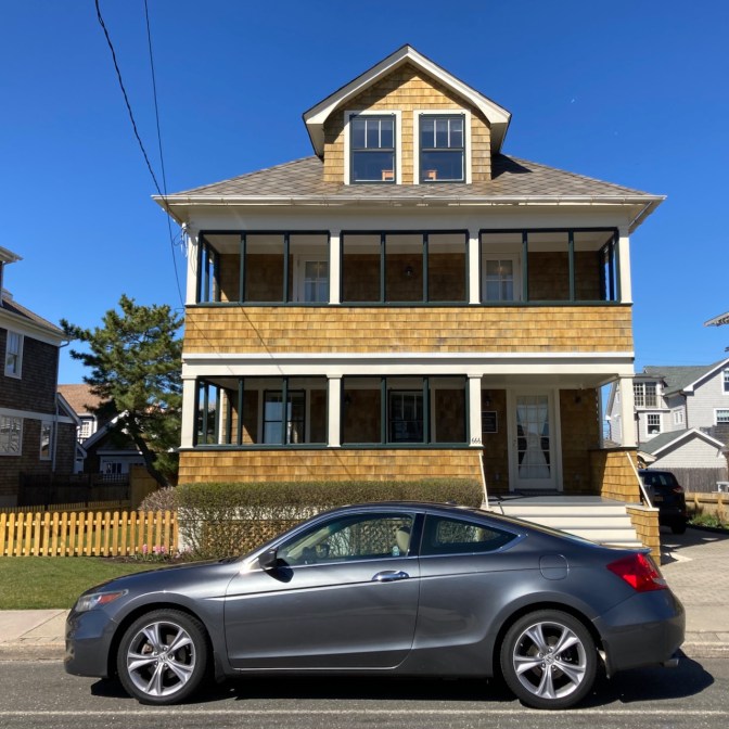 2012 Honda Accord parked in front of two-story house.