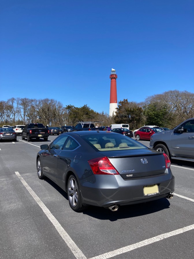 2012 Honda Accord in parking lot, with Barnegat Light in background.