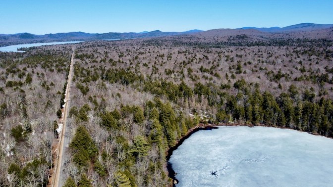 View of edge of Quiver Pond, along with South Shore Road.
