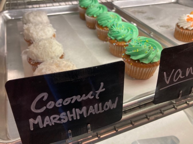 Cupcakes in glass case.