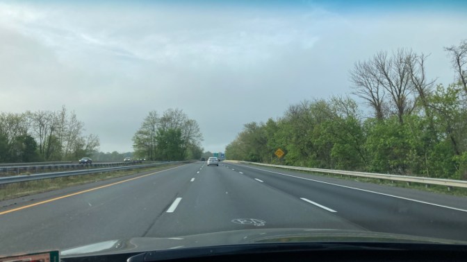 View of I-295 under a partly cloudy sky.