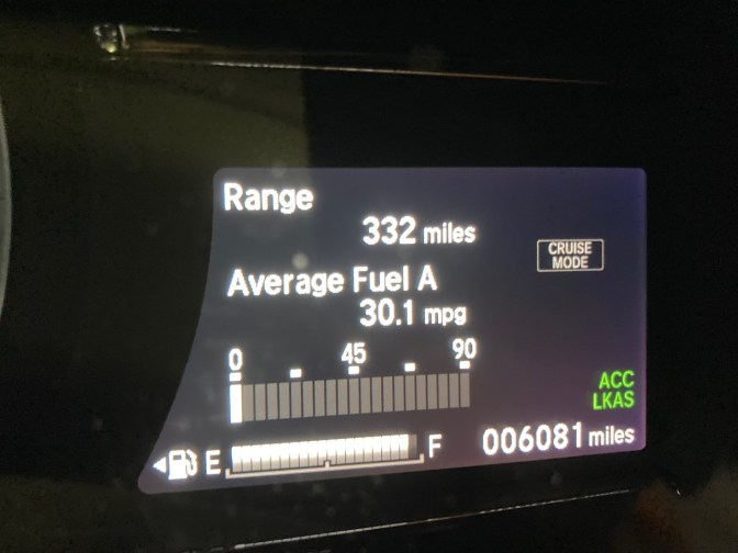 Car odometer reading 006081 miles.