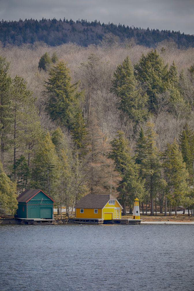 Two boat houses on Old Forge Pond.