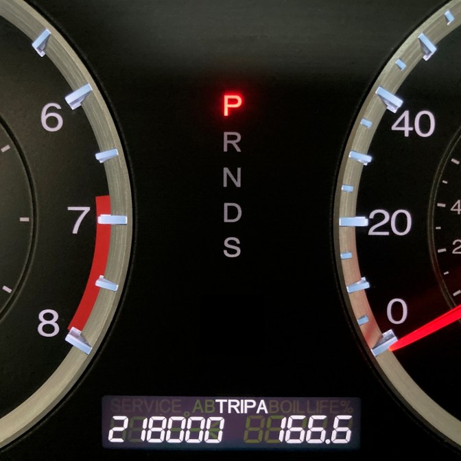 Car odometer reading 218000 TRIP A 166.6