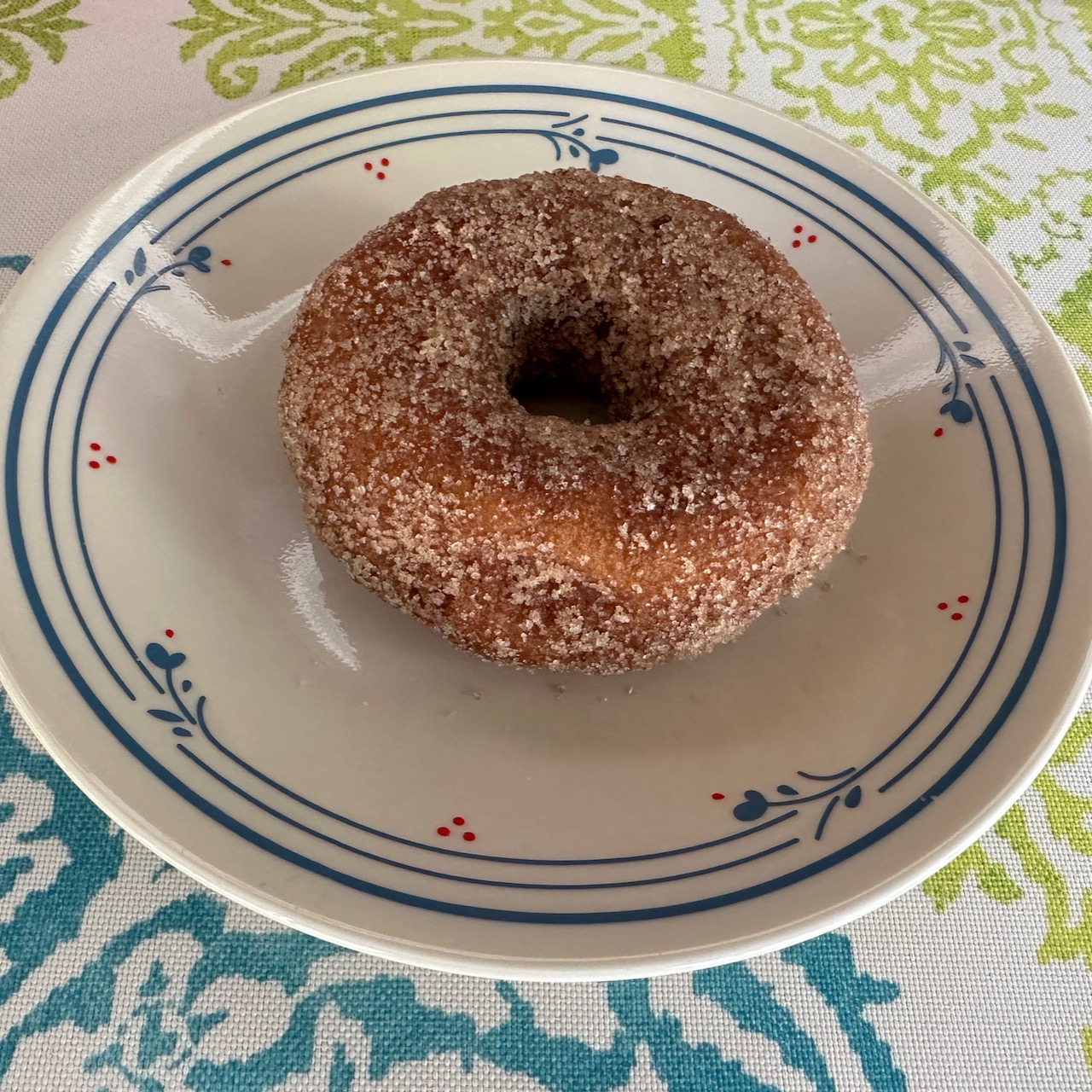 Donut on white plate.