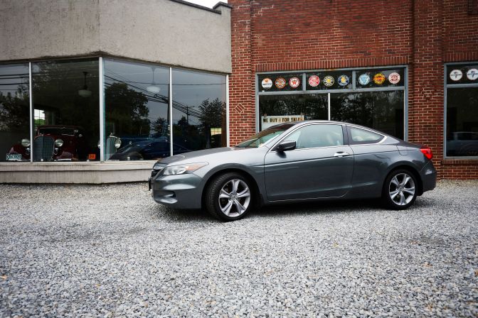 2012 Honda Accord coupe parked in front of Old Pokes Car Museum.