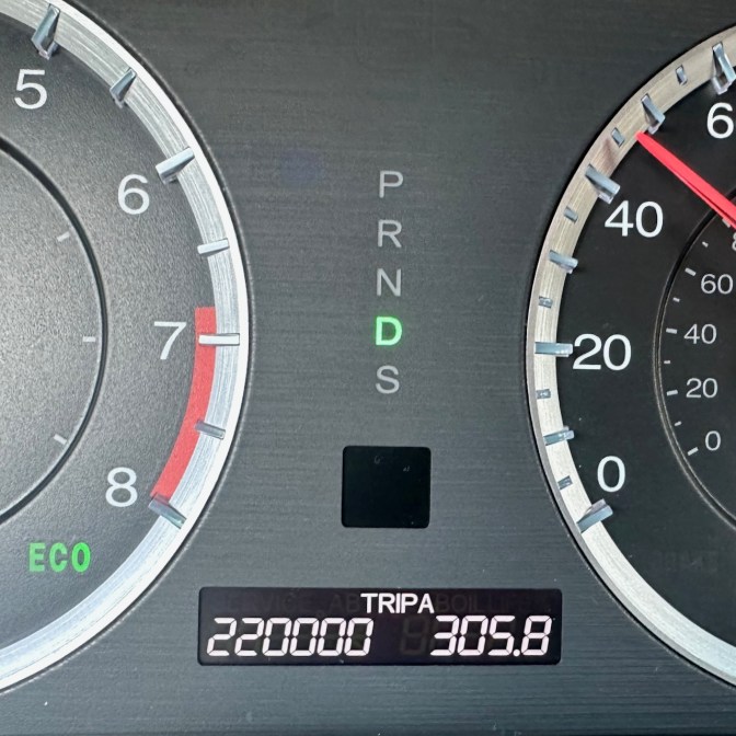 Car odometer reading 220,000 TRIP A 305.8