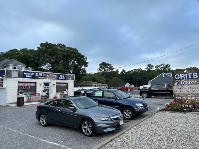 2012 Honda Accord coupe parked in front of Grits and Grace restaurant.
