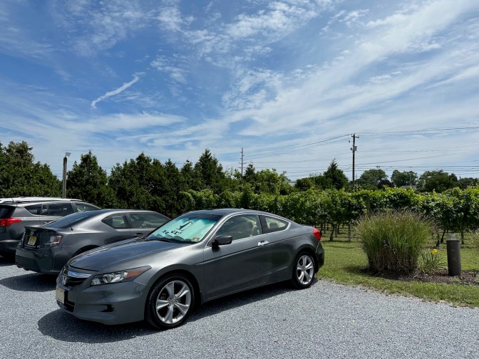 2012 Honda Accord parked in front of vineyard.