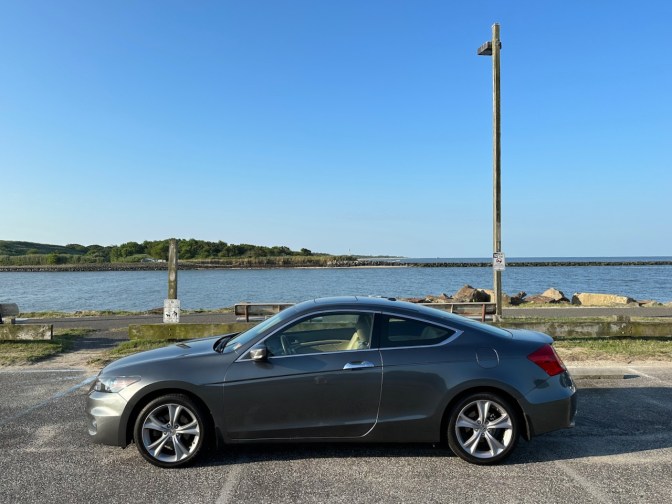 2012 Honda Accord parked in front of Cape May Ferry channel.