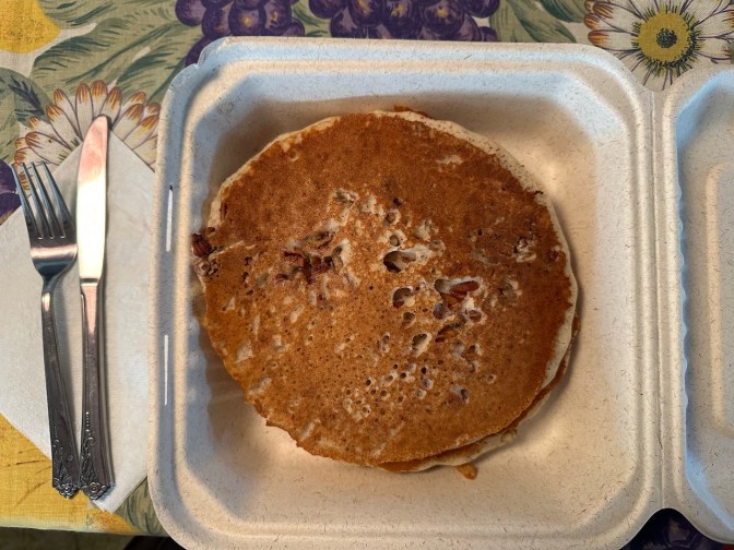 Pancakes in takeout container.