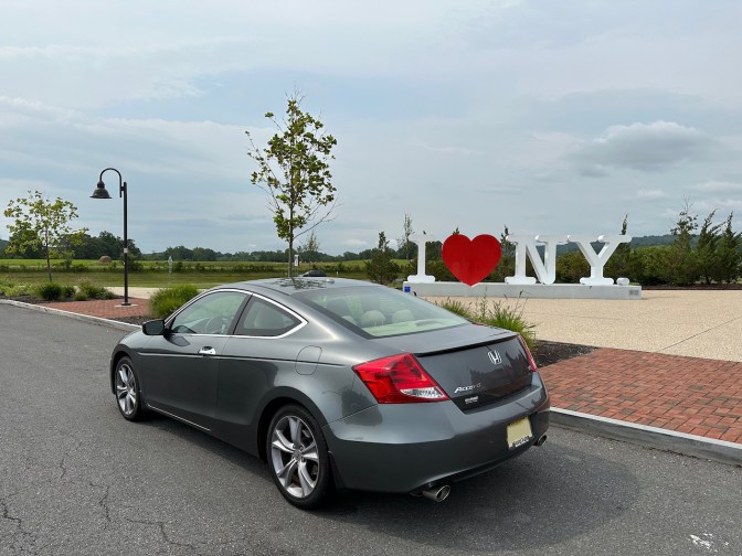 2012 Honda Accord parked in front of I LOVE NEW YORK sign.